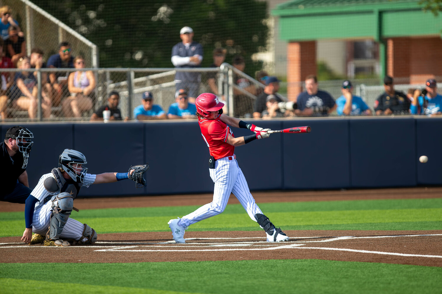 A Katy player hits during Saturday's Regional Quarterfinal between Katy and Tompkins at Cy-Springs.